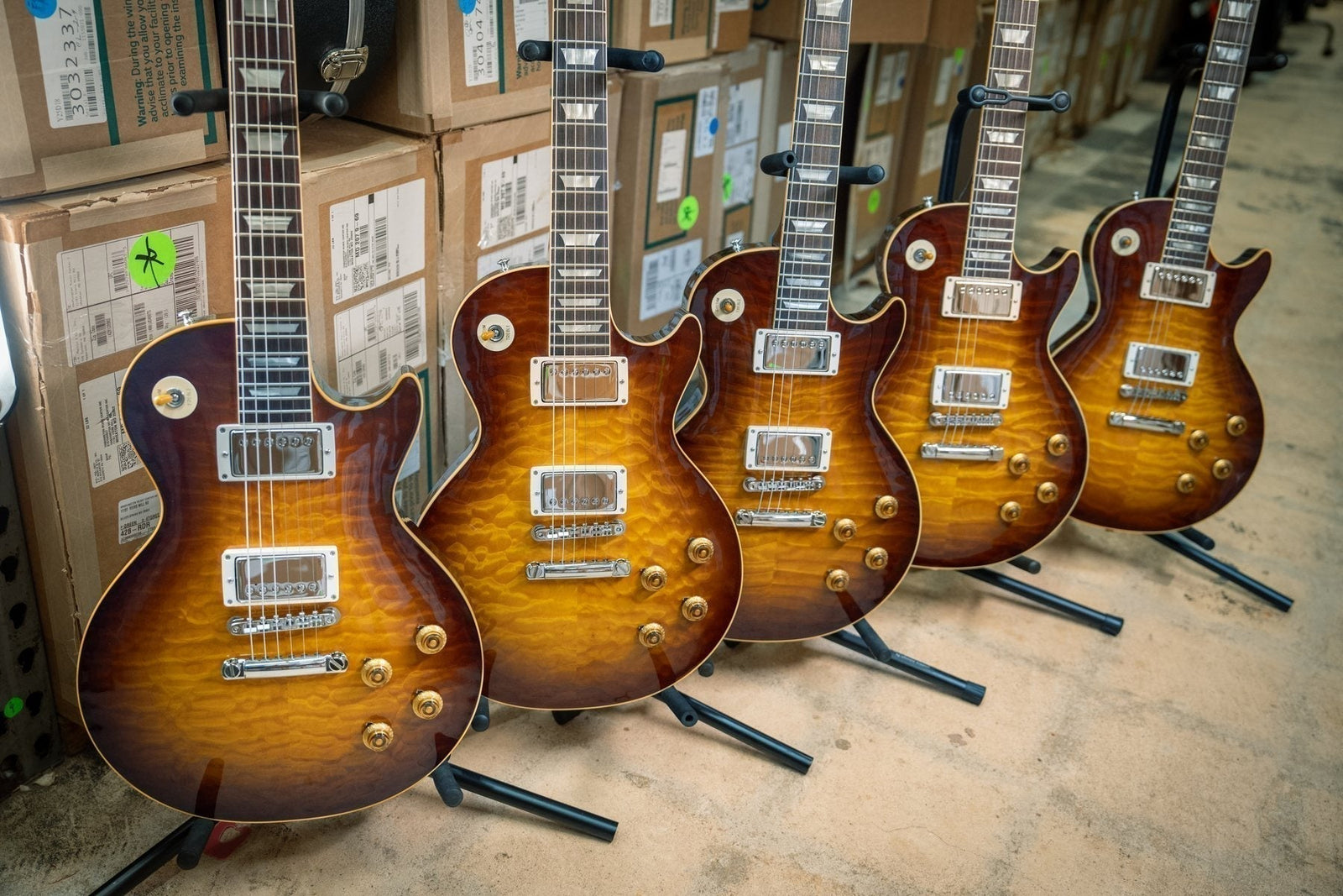 Five Gibson Custom Shop 1959 Les Paul Standard Reissues with hand-selected quilted maple tops in Faded Tobacco Sunburst at Chuck Levin's