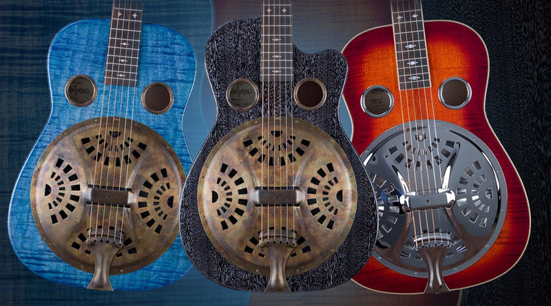 Three resonator guitars in blue, black, and red on a dark background